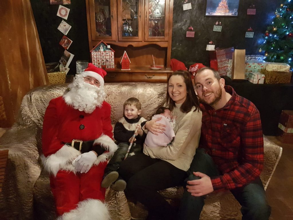 Adam with baby sister Evie and Father Christmas