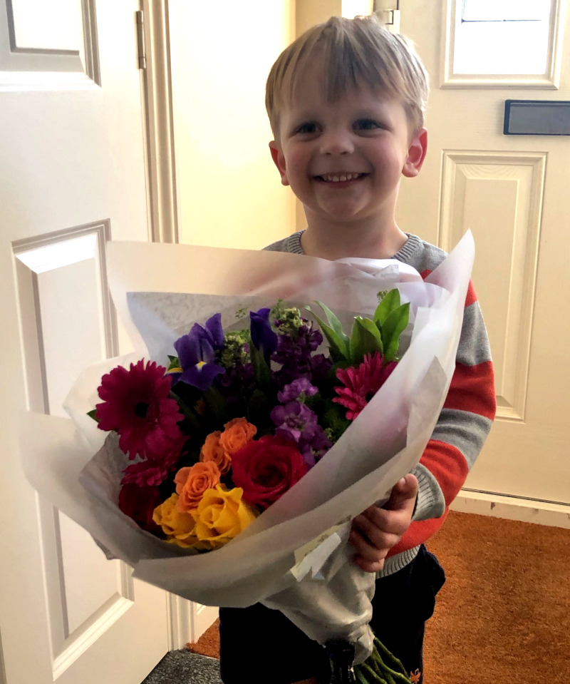 Alfie with flowers on Mother's Day