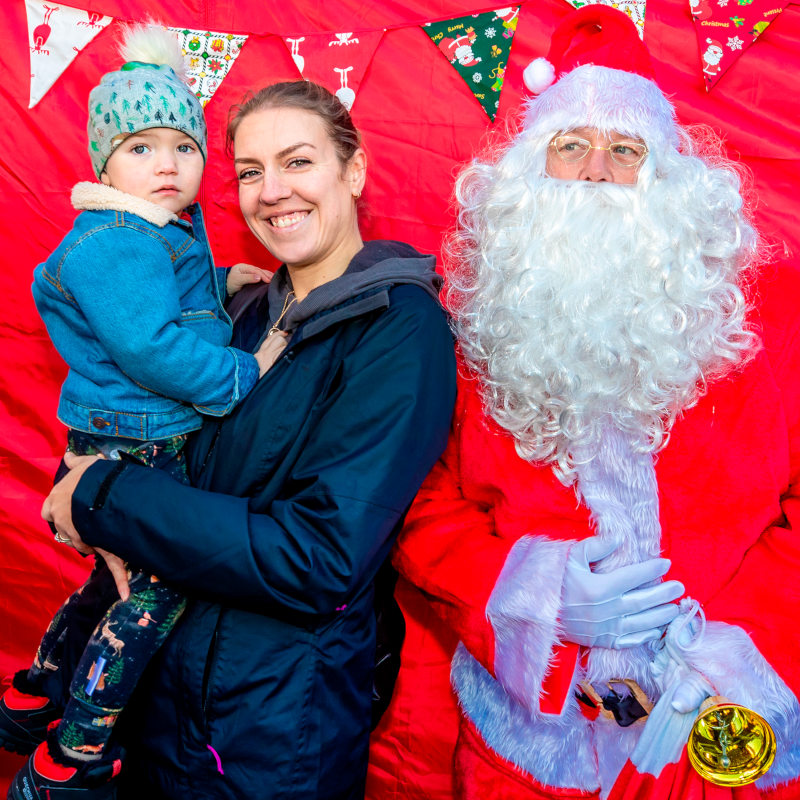 Leonie and Bear with Santa in 2021