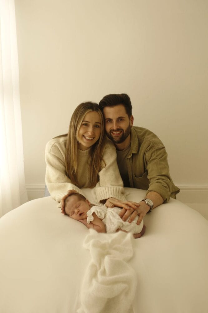Josh and Katie with their newborn daughter, Théa