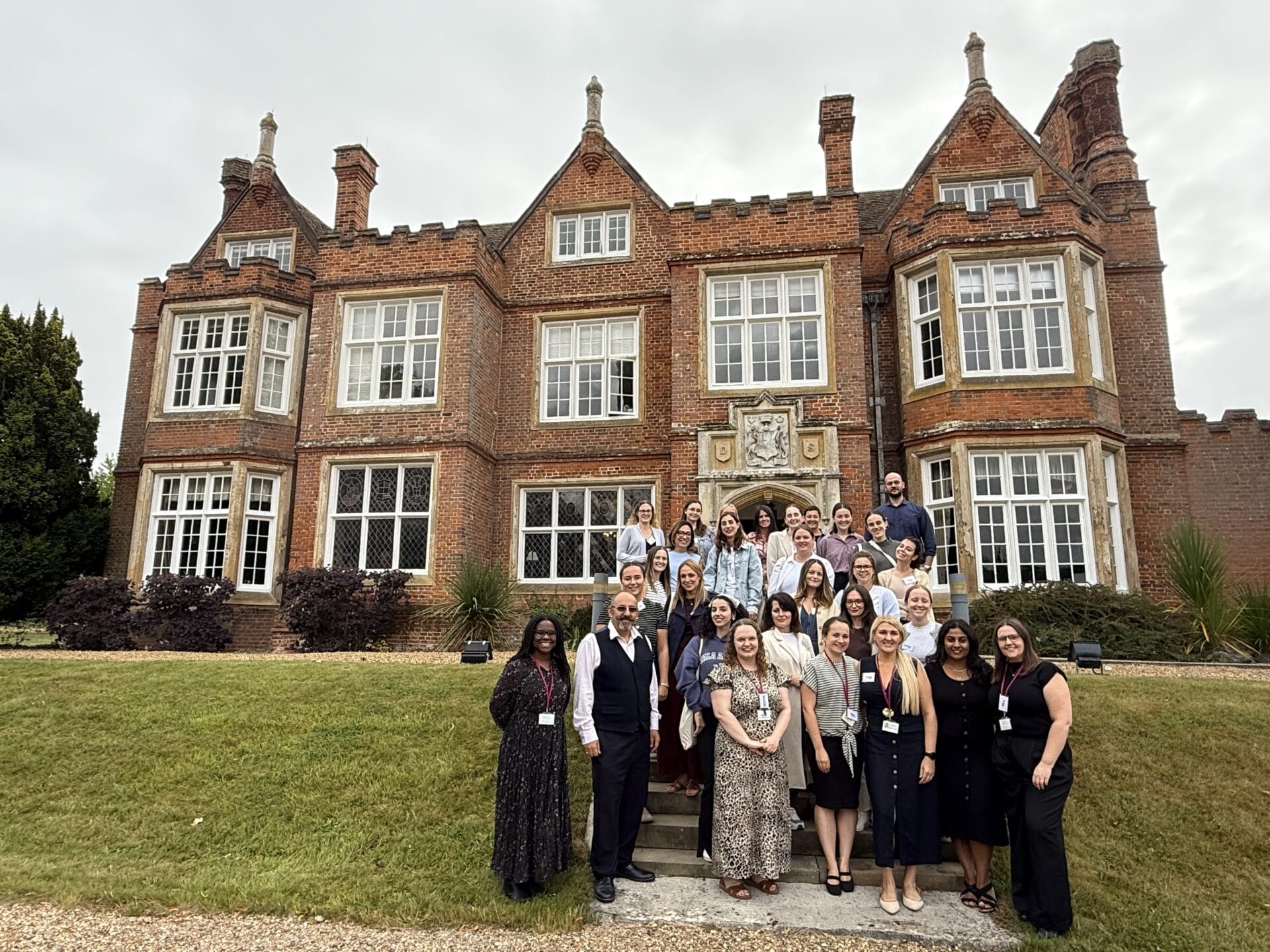 A photograph of the Bourn Hall team outside Bourn Hall's Cambridge location.